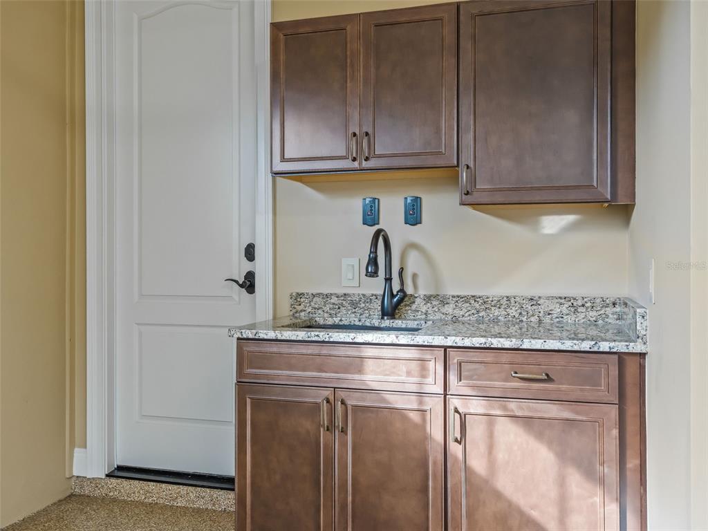 7549 Northwest 33rd Place Ocala, FL 34482 - Photo 56 of 83 a kitchen with appliances cabinets and a counter top space