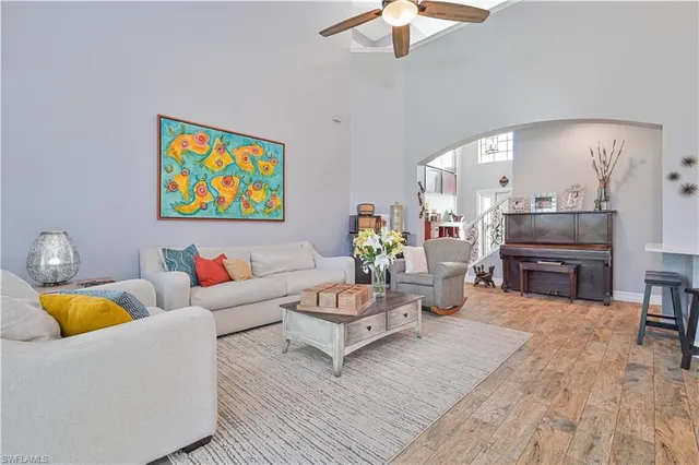 a open dining room with stainless steel appliances granite countertop furniture a chandelier and kitchen view