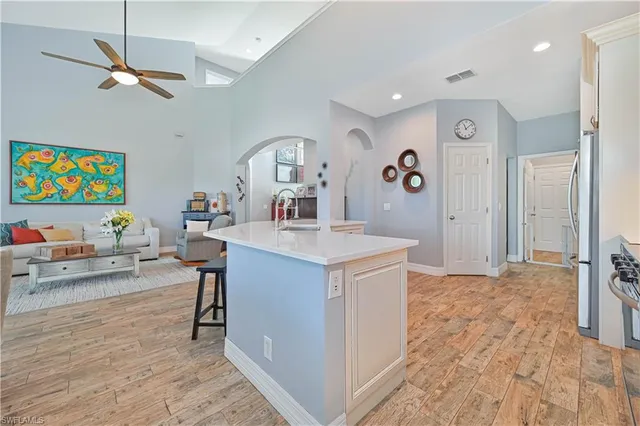 a kitchen with a sink cabinets and window