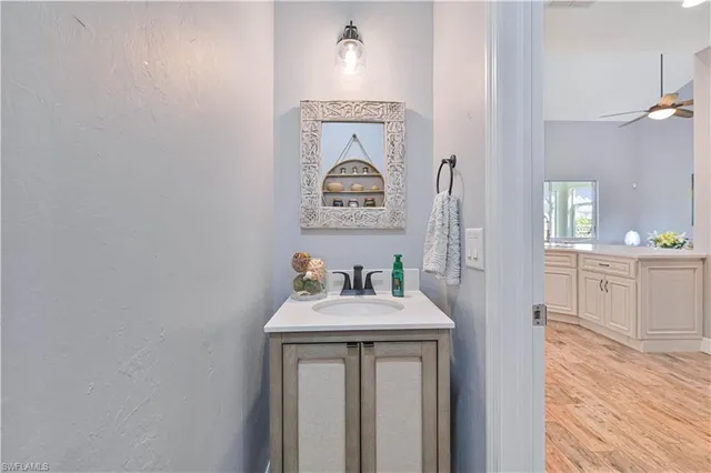 a bathroom with a double vanity sink and mirror