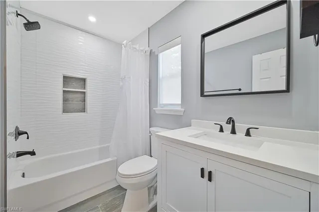 a bedroom with a bed and a book shelf