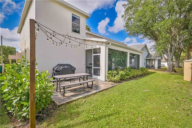 an aerial view of residential house with outdoor space and pool