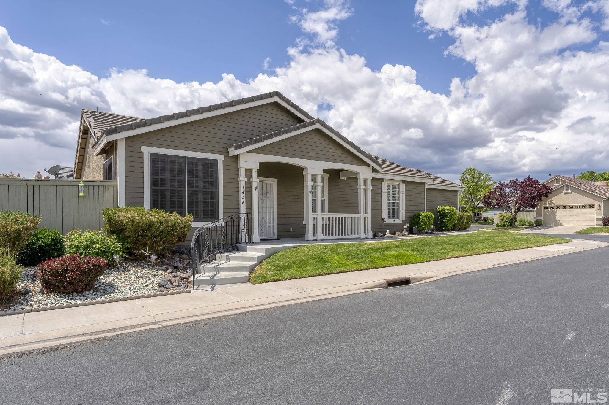1436 Gaucho Lane Reno, NV 89521 - Photo 1 of 40 a front view of house with yard and green space