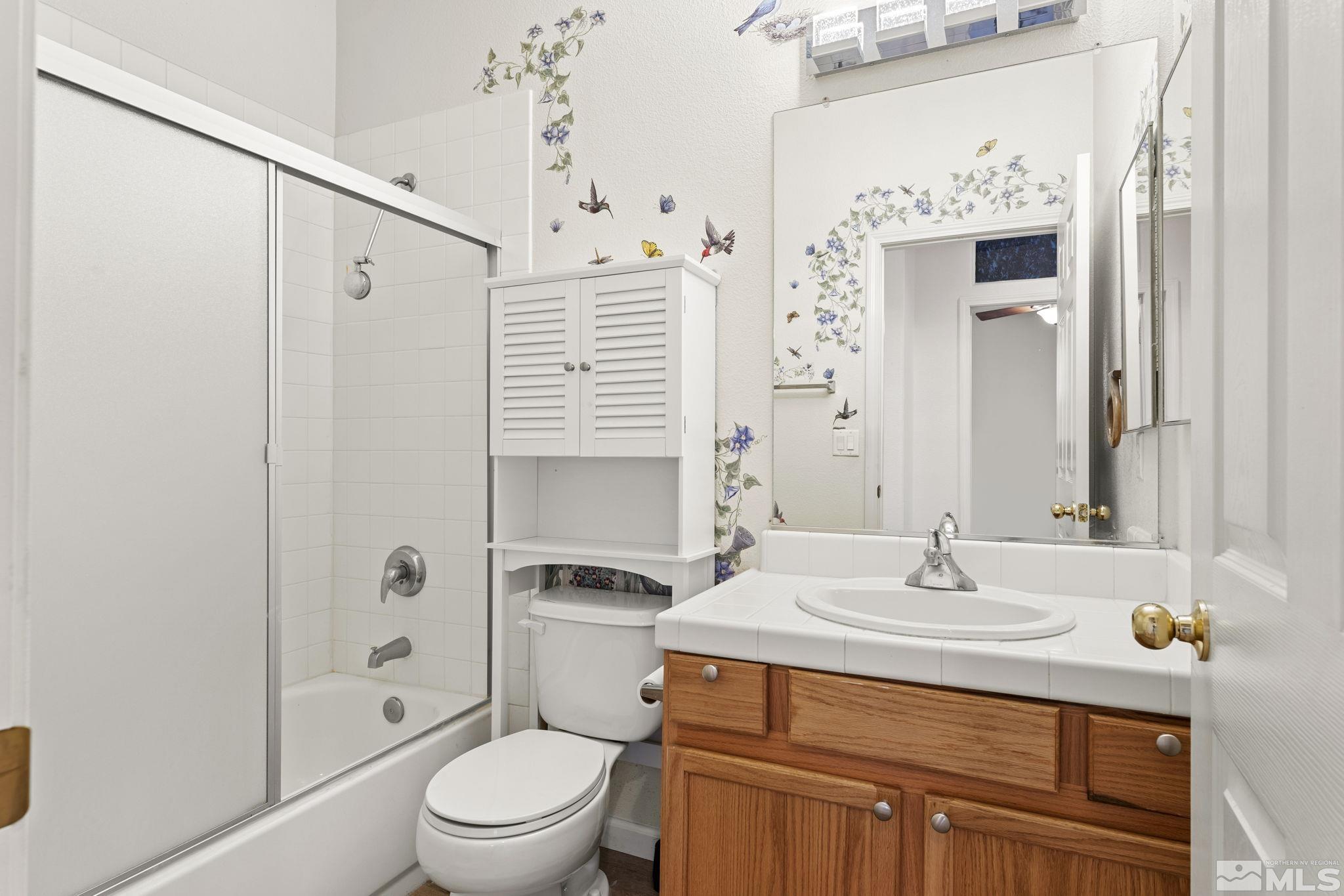 1436 Gaucho Lane Reno, NV 89521 - Photo 14 of 40 a bathroom with a sink toilet and shower
