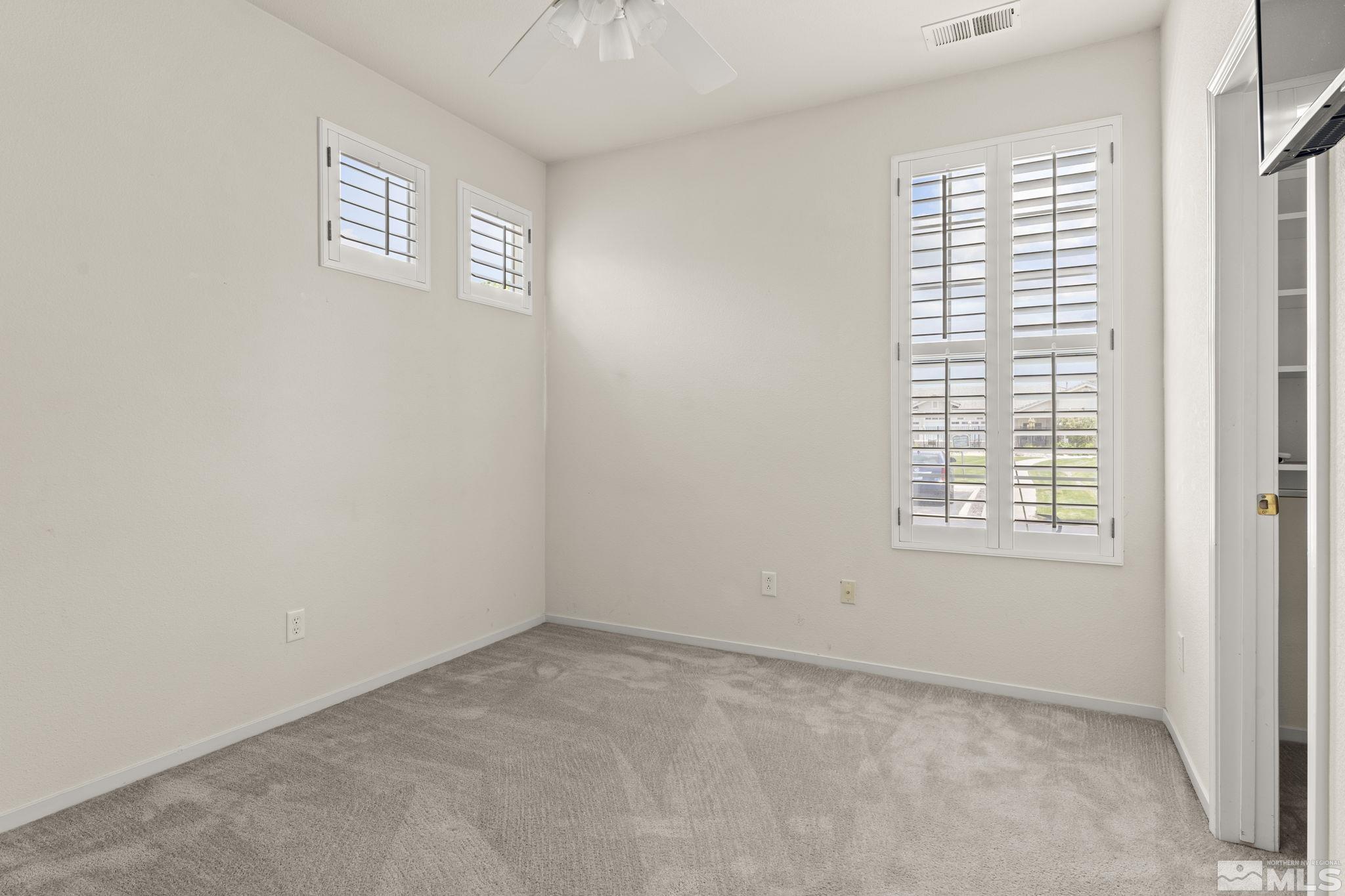 1436 Gaucho Lane Reno, NV 89521 - Photo 15 of 40 an empty room with a window