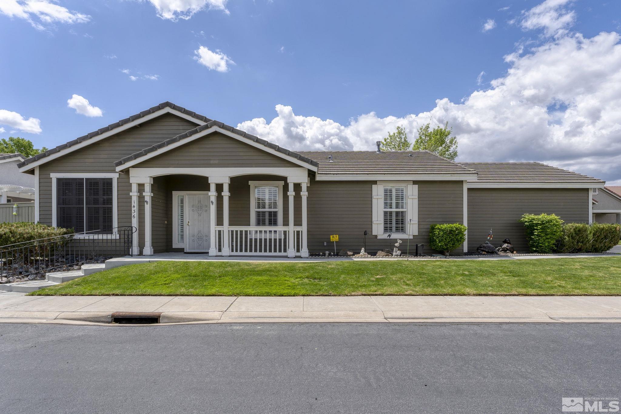1436 Gaucho Lane Reno, NV 89521 - Photo 2 of 40 a front view of house with yard and green space