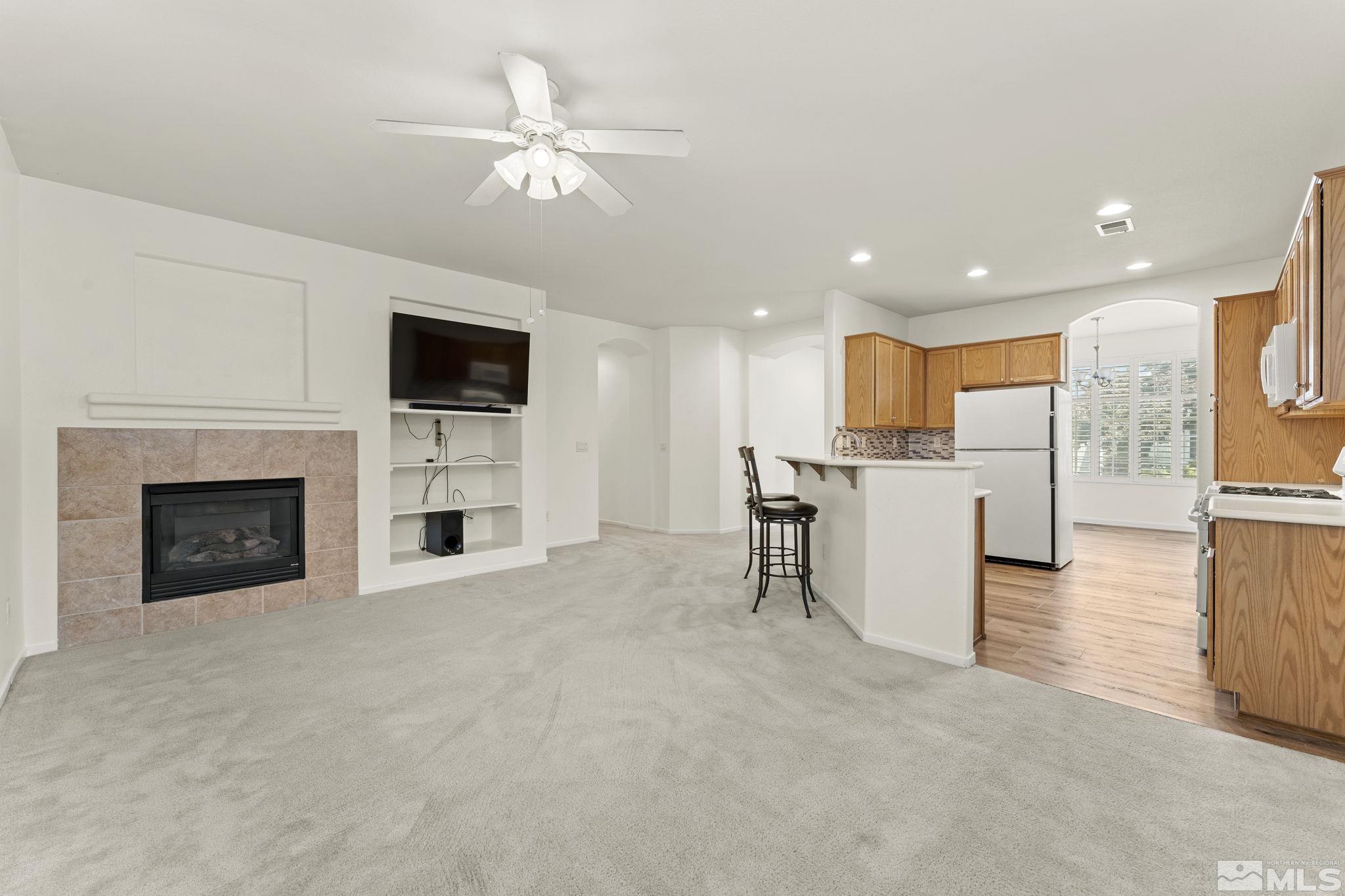 1436 Gaucho Lane Reno, NV 89521 - Photo 28 of 40 a view of kitchen with furniture and a fireplace