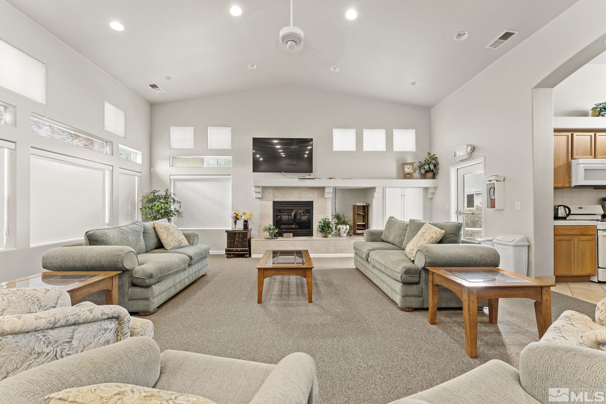 1436 Gaucho Lane Reno, NV 89521 - Photo 36 of 40 a living room with furniture fireplace and a flat screen tv
