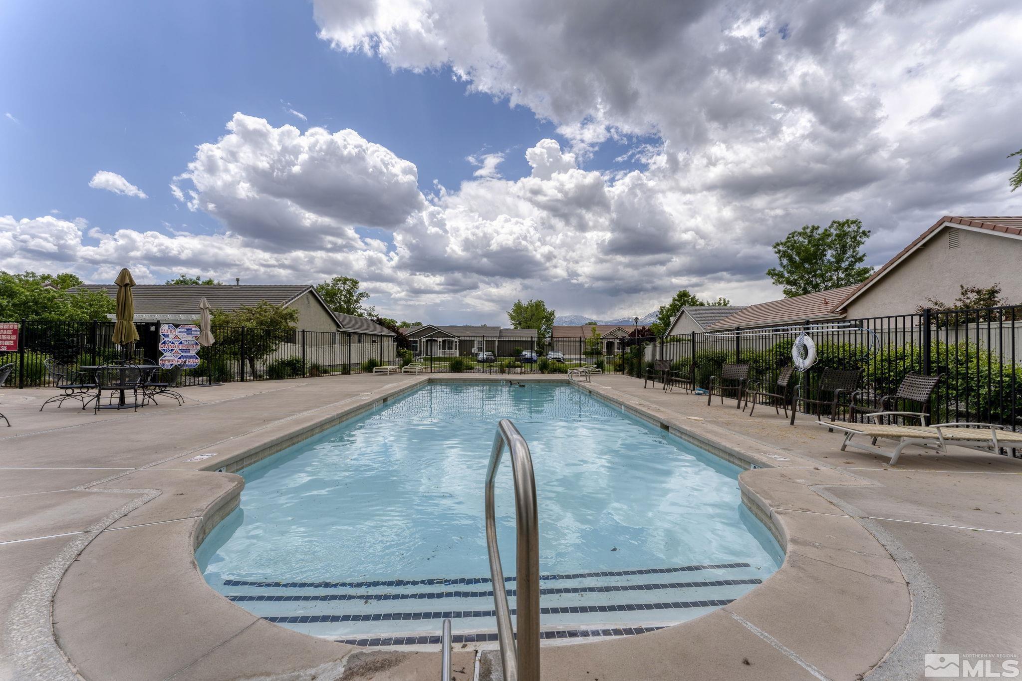 1436 Gaucho Lane Reno, NV 89521 - Photo 37 of 40 a view of a swimming pool with a yard