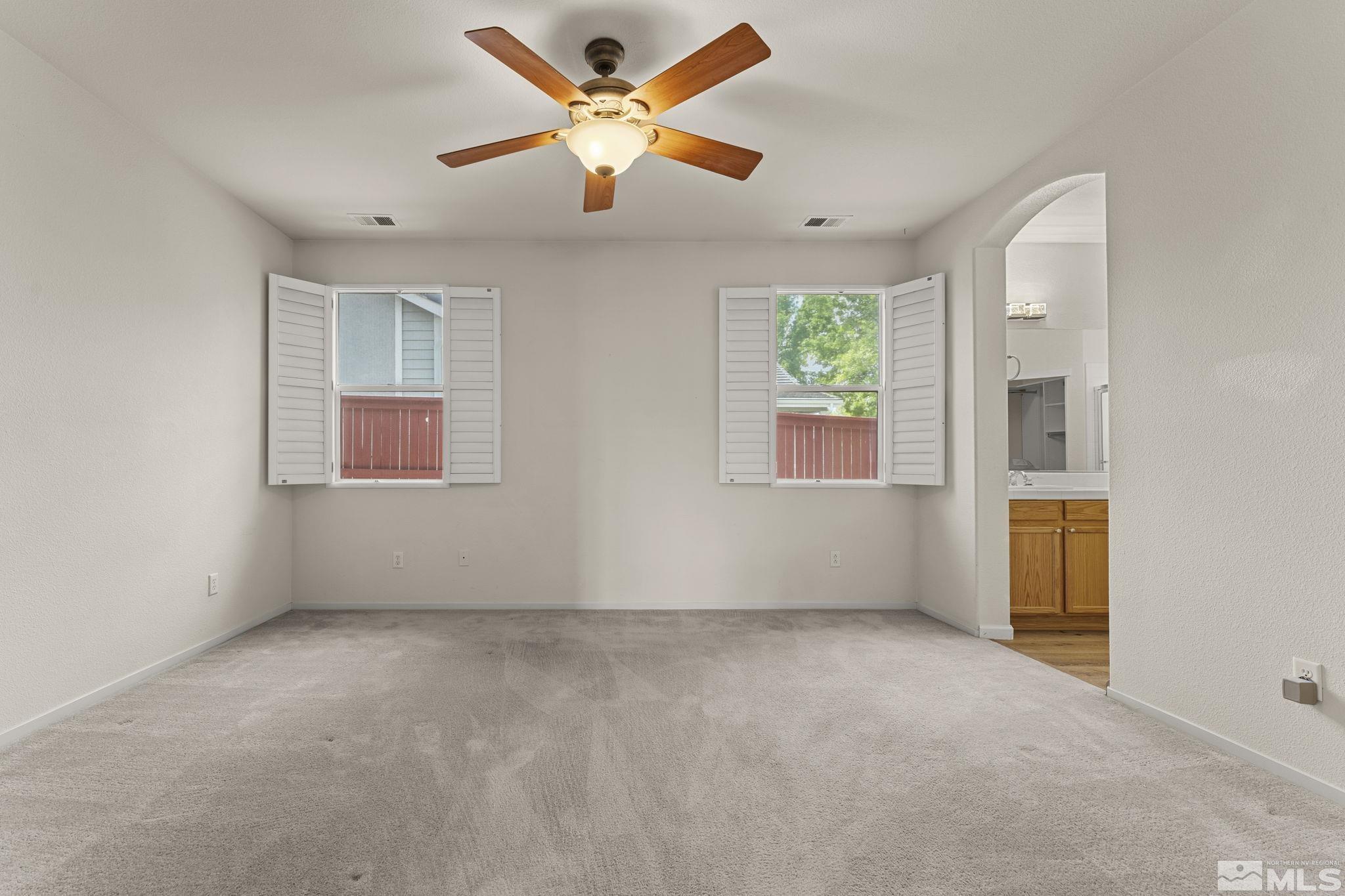 1436 Gaucho Lane Reno, NV 89521 - Photo 6 of 40 a view of an empty room with a window