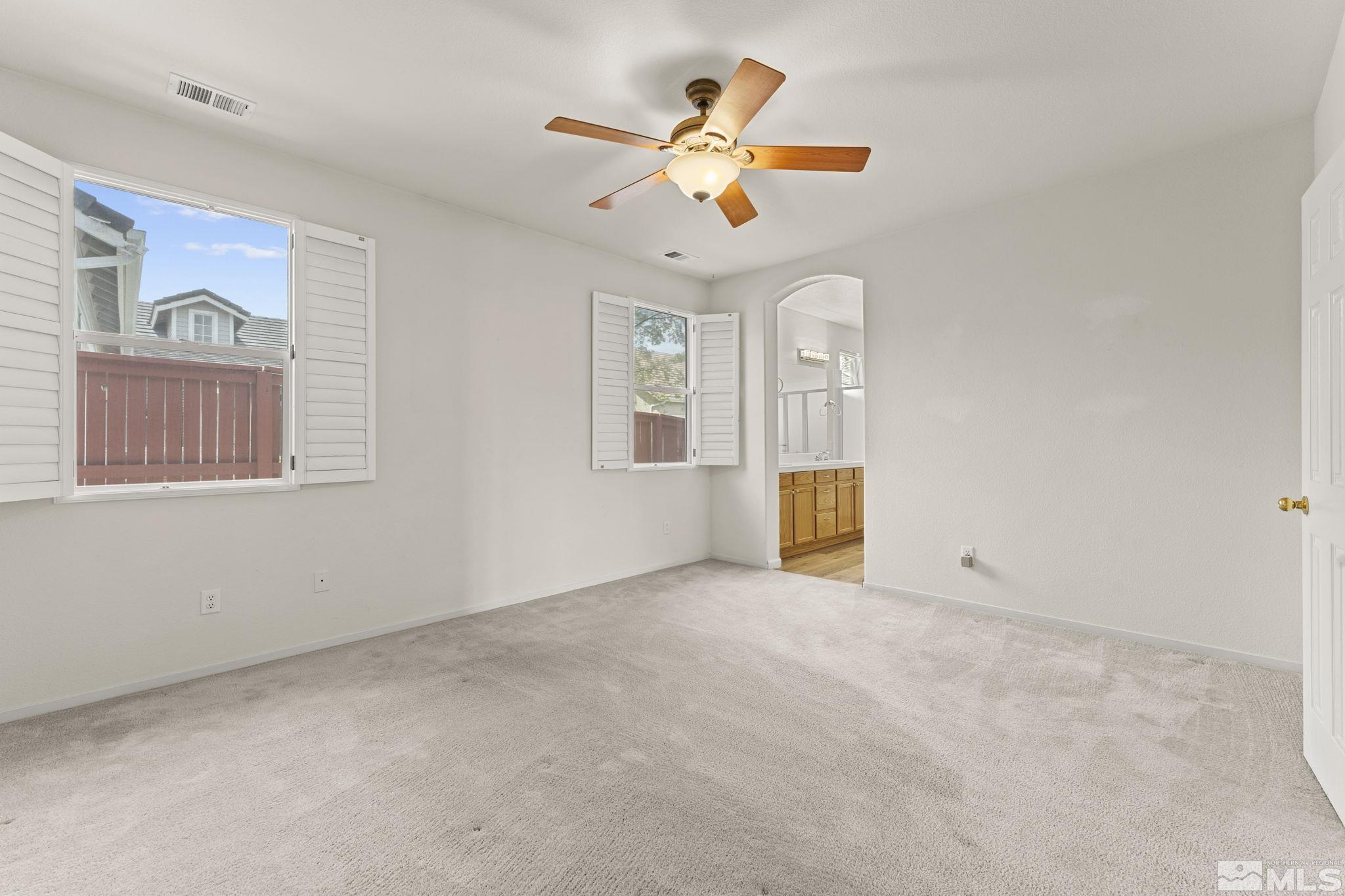 1436 Gaucho Lane Reno, NV 89521 - Photo 7 of 40 a view of an empty room with a window