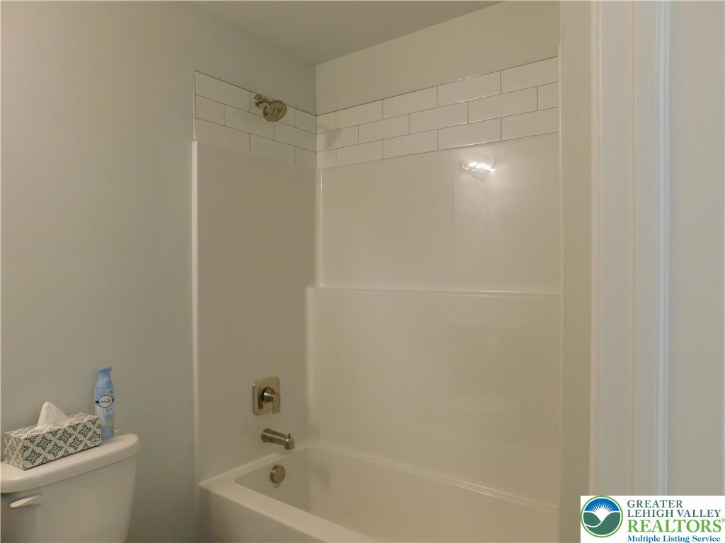6645 Stein Way, Unit 66396661 Lower Macungie Township, PA 18062 - Photo 13 of 20 a bathroom with a bathtub