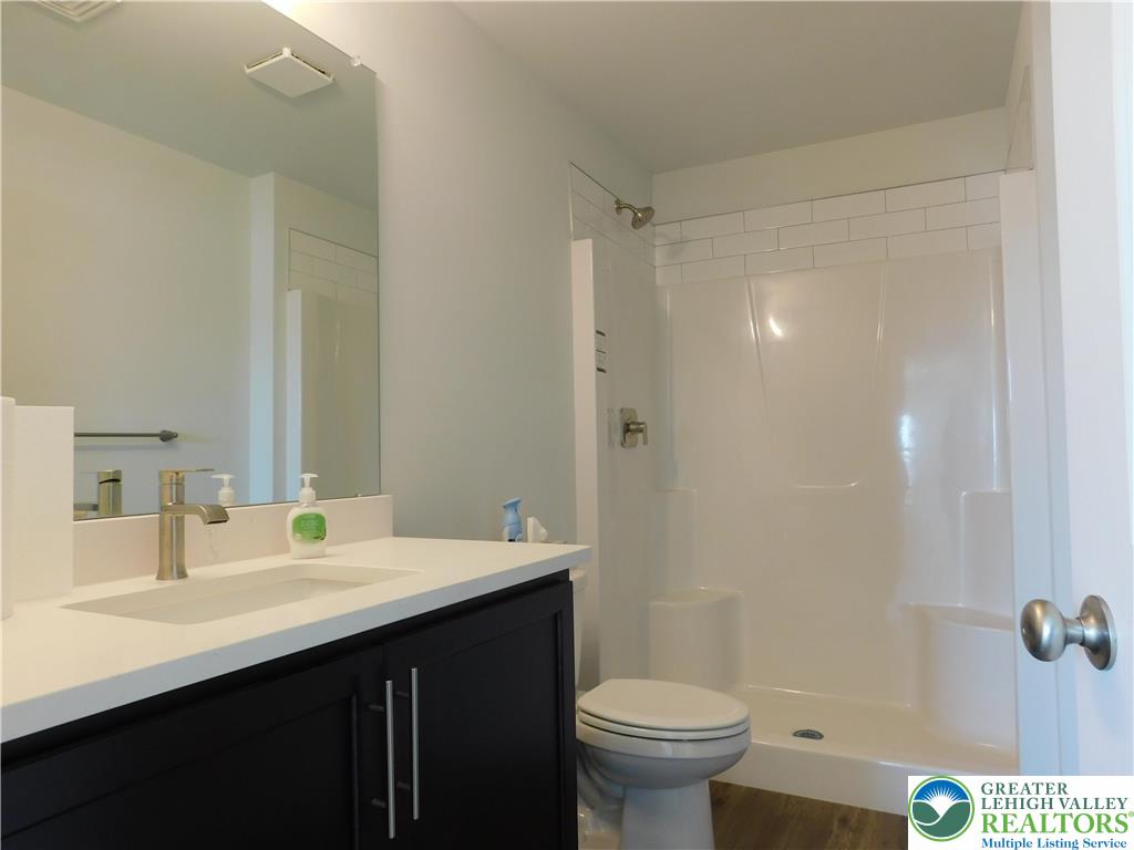 6645 Stein Way, Unit 66396661 Lower Macungie Township, PA 18062 - Photo 15 of 20 a bathroom with a sink and a mirror