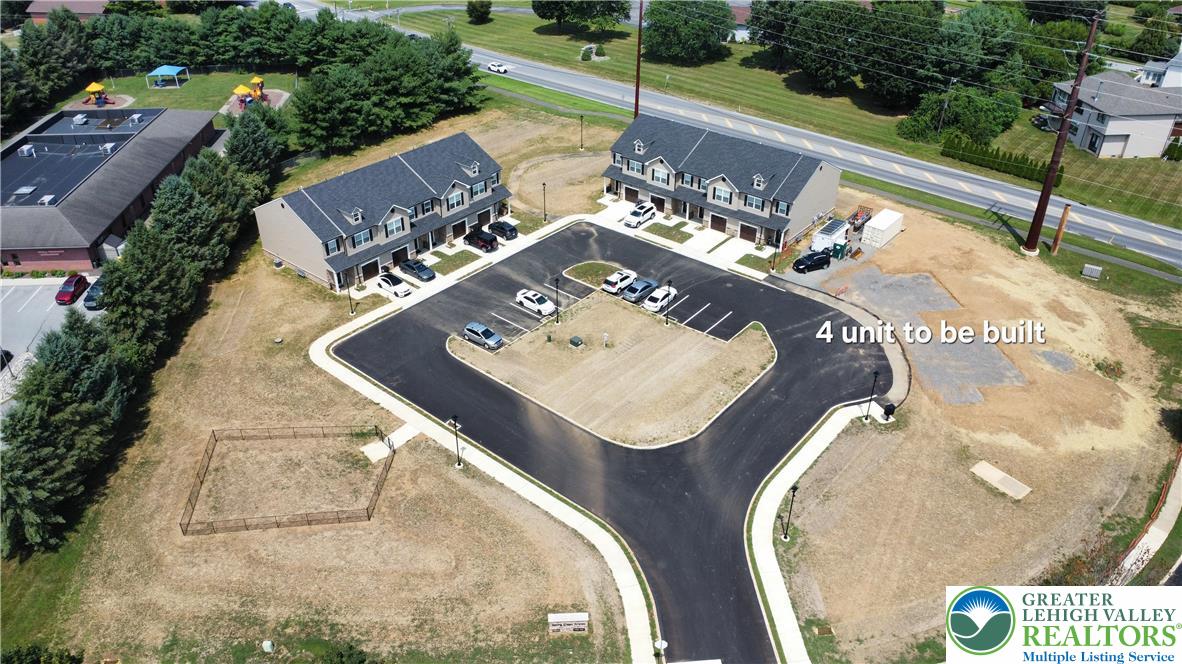 6645 Stein Way, Unit 66396661 Lower Macungie Township, PA 18062 - Photo 2 of 20 an aerial view of a house with a swimming pool