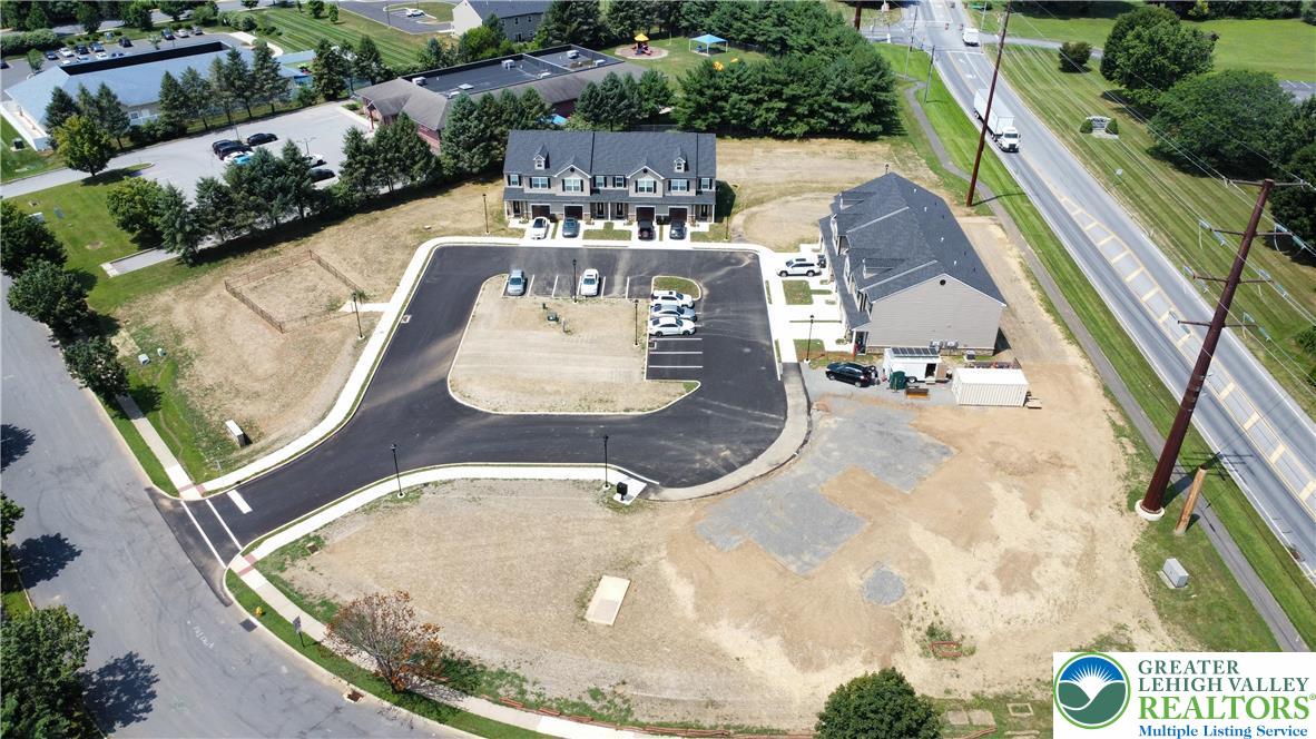 6645 Stein Way, Unit 66396661 Lower Macungie Township, PA 18062 - Photo 3 of 20 an aerial view of a house with outdoor space