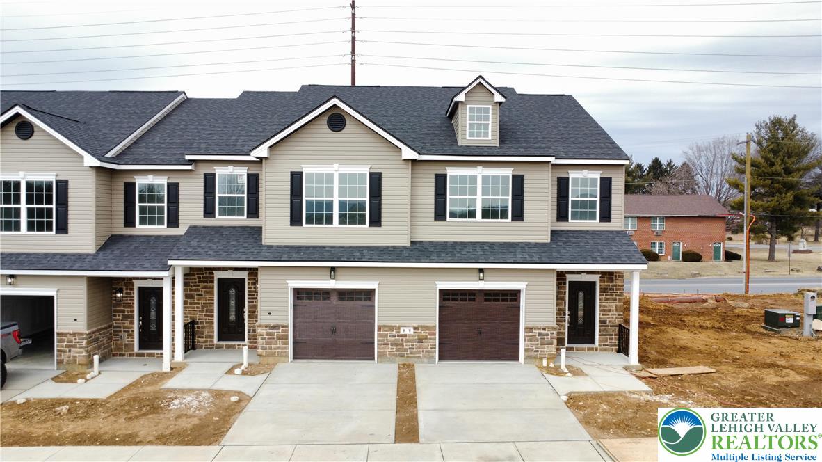 6645 Stein Way, Unit 66396661 Lower Macungie Township, PA 18062 - Photo 4 of 20 a front view of a house with yard