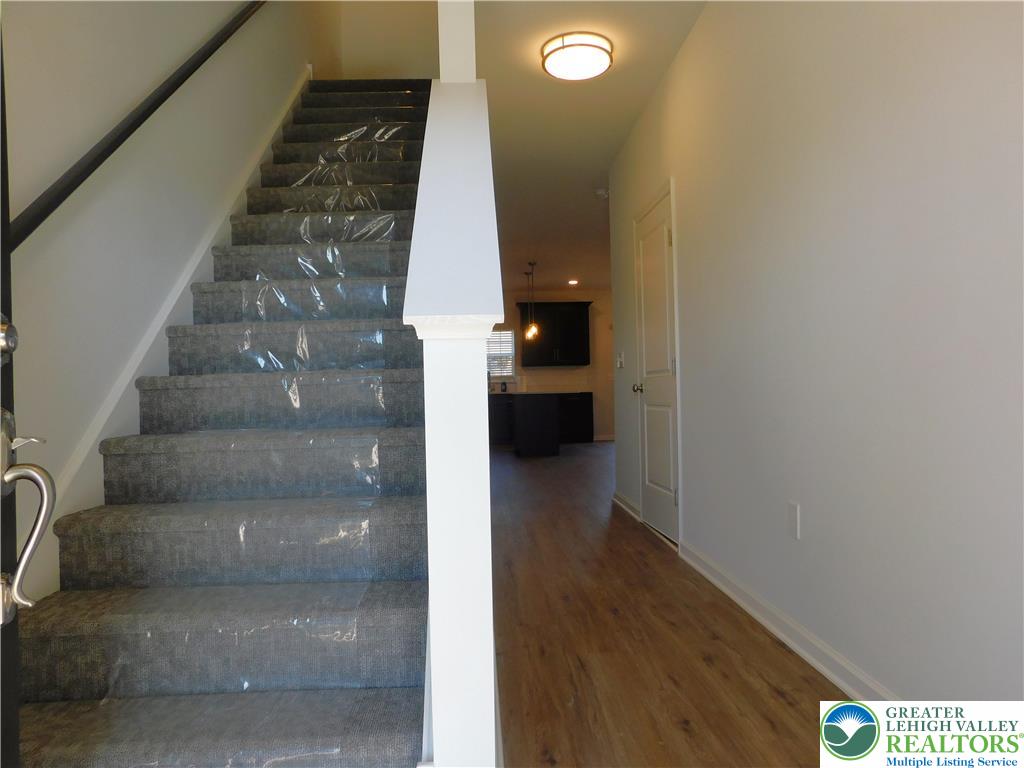 6645 Stein Way, Unit 66396661 Lower Macungie Township, PA 18062 - Photo 5 of 20 a view of entryway and hall with wooden floor
