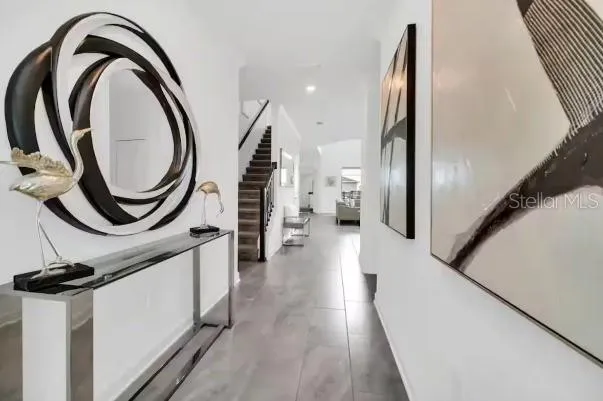 a view of a hallway with washer and dryer