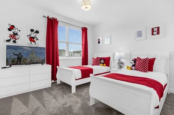 a bedroom with bed and a window