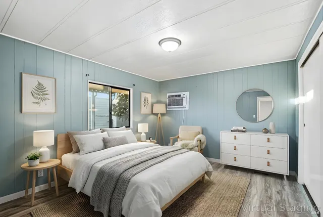 a bedroom with a bed and window