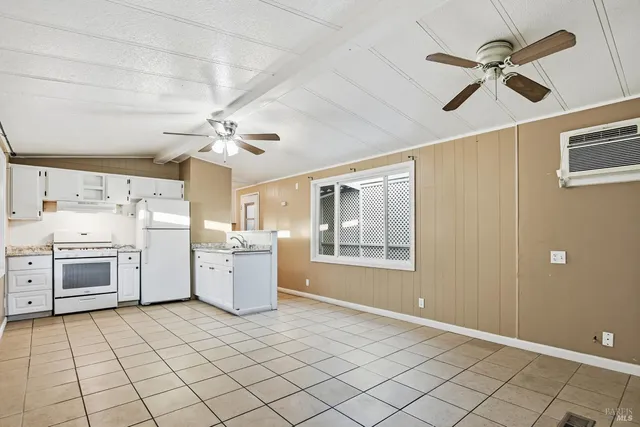 a kitchen with a stove a sink and a refrigerator
