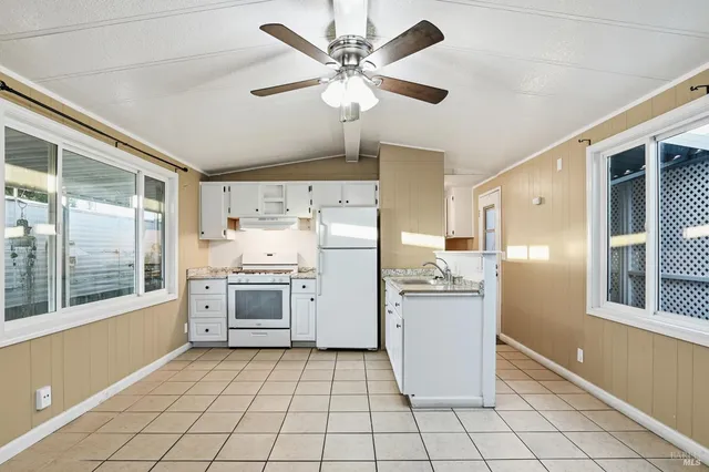 a kitchen with a cabinets and window