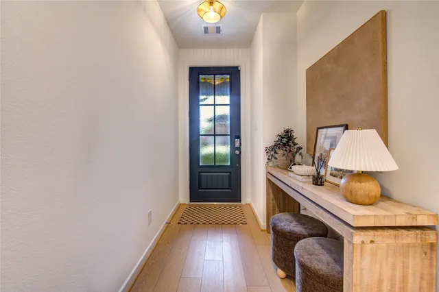 a bedroom with a bed and a potted plant