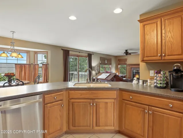 a kitchen with cabinets and window