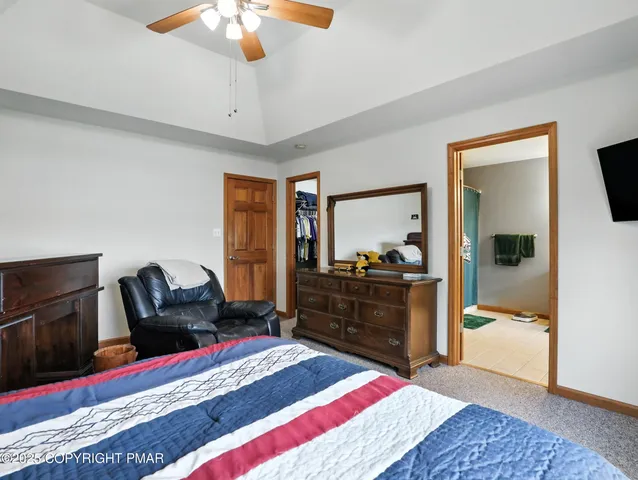 a bed room with a bed and a mirror