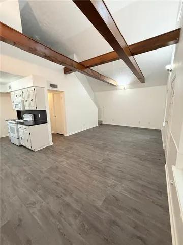 a view of a livingroom with wooden floor