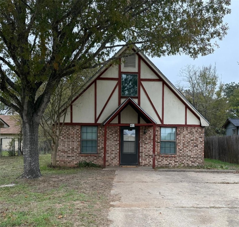 4211 Marsh Street Bryan, TX 77803 - Photo 13 of 13 a house with a small yard in front of it