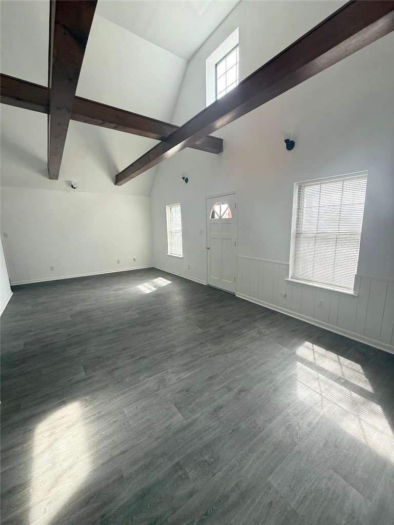 4211 Marsh Street Bryan, TX 77803 - Photo 2 of 15 an empty room with wooden floor and windows