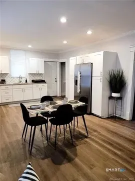 a kitchen with a table and chairs in it