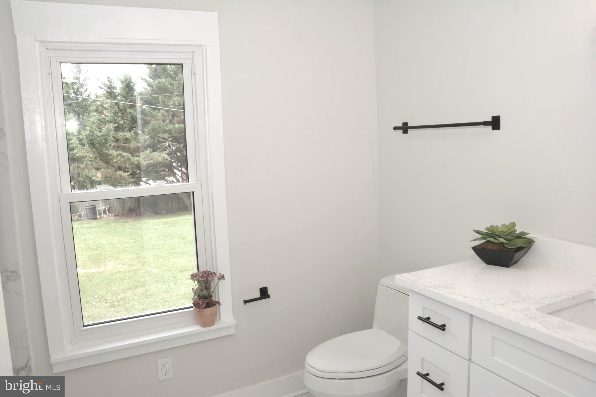1006 Circle Drive Keymar, MD 21757 - Photo 18 of 57 a bathroom with a toilet sink and window