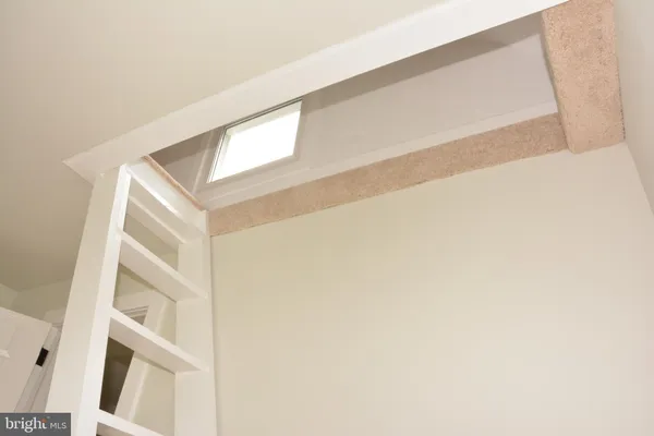 a room with a bed and a window