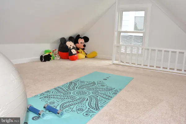 a room with a bed furniture and a window