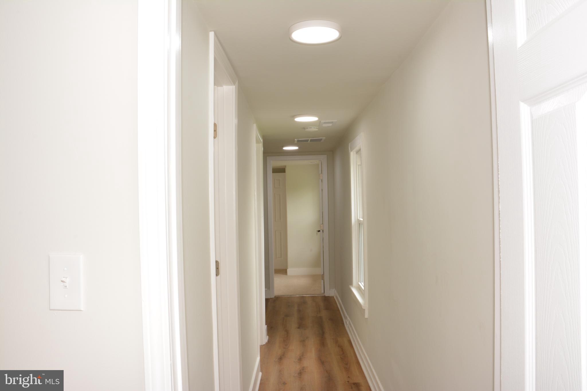 1006 Circle Drive Keymar, MD 21757 - Photo 31 of 57 a view of a hallway with wooden floor