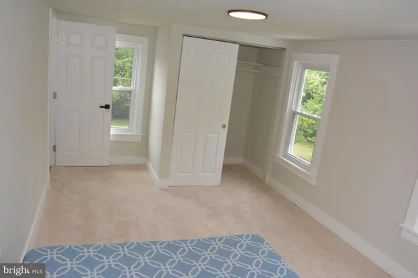 a bathroom with a mirror sink and vanity