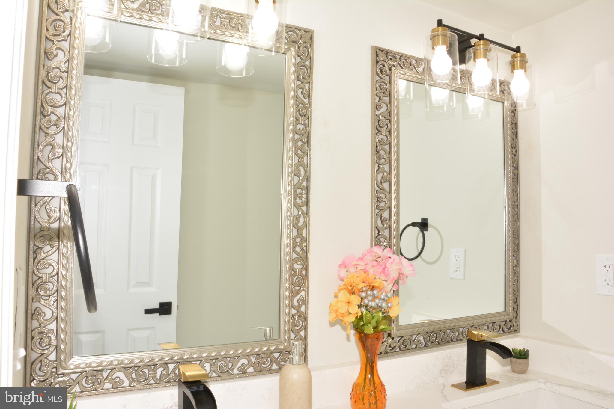 1006 Circle Drive Keymar, MD 21757 - Photo 38 of 57 a bathroom with a mirror sink and vanity