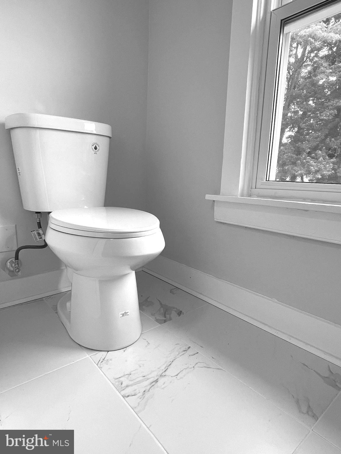 1006 Circle Drive Keymar, MD 21757 - Photo 42 of 57 a white toilet sitting next to a window