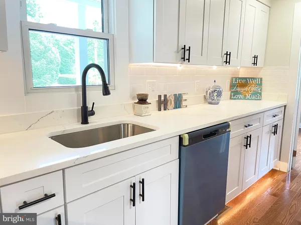 a kitchen with a sink and a window