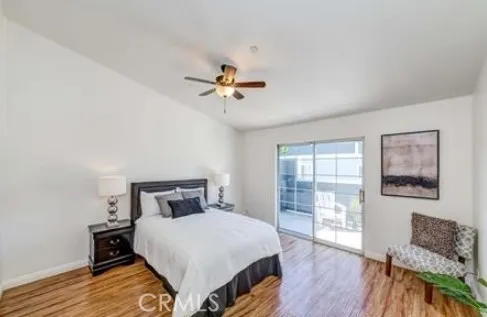 a bedroom with a bed and a table