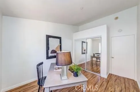 a workspace with furniture and wooden floor