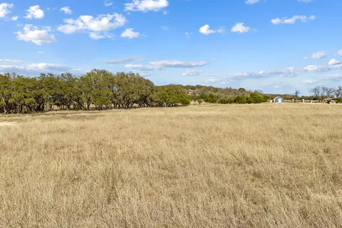 a view of a lake with a big yard