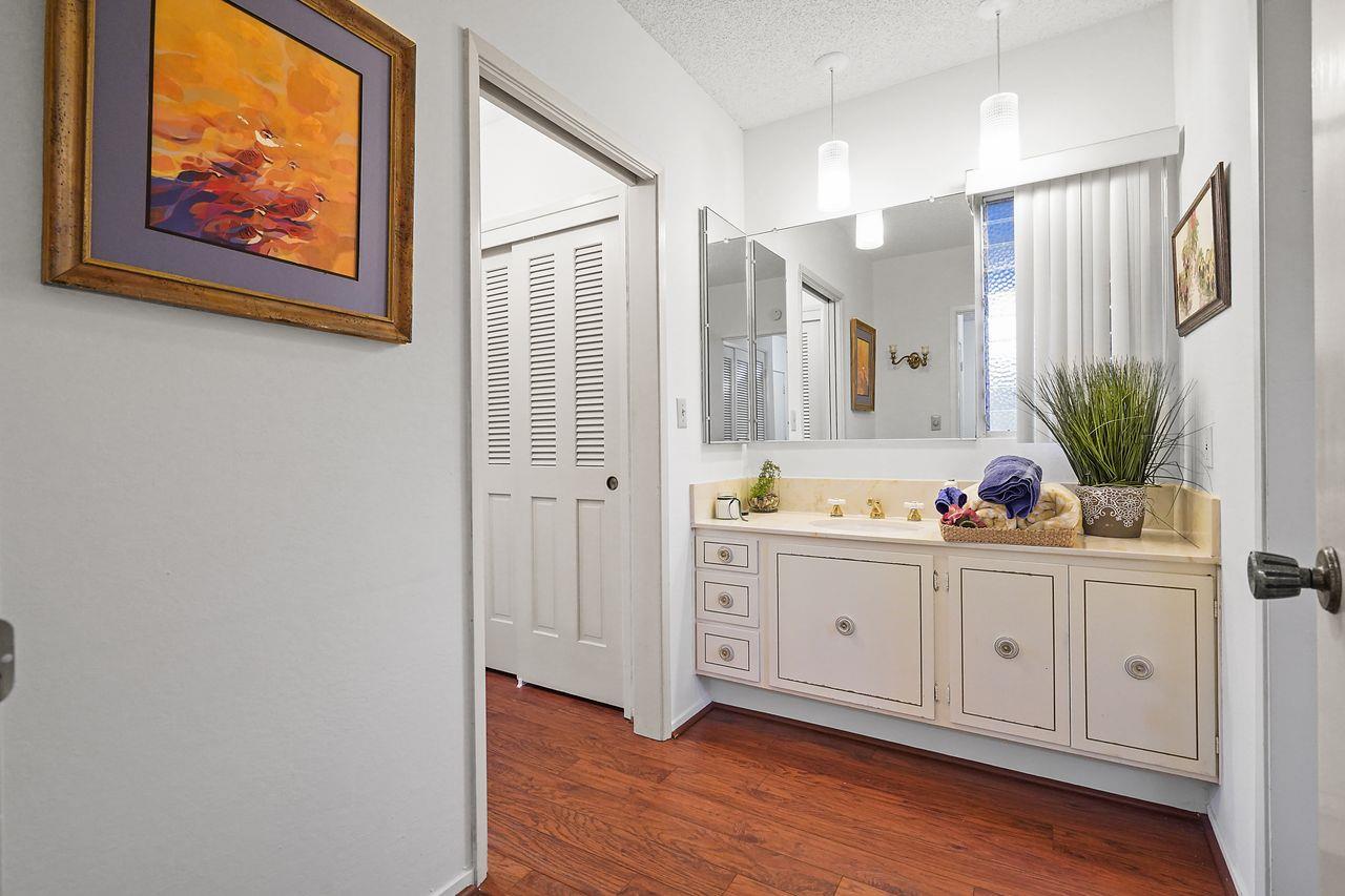 124 Del Mesa Carmel Carmel, CA 93923 - Photo 11 of 28 a spacious bathroom with a double vanity sink and a mirror