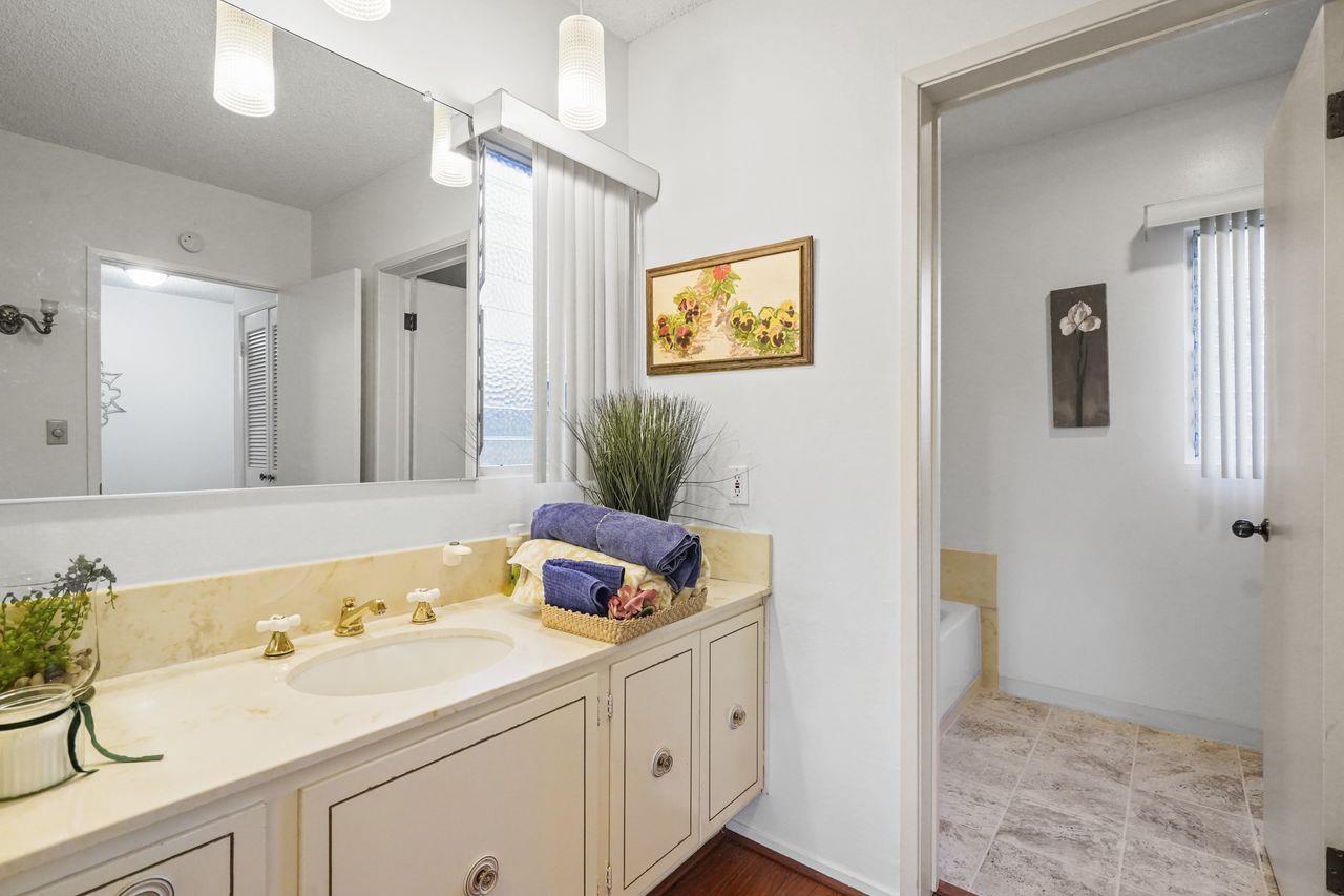 124 Del Mesa Carmel Carmel, CA 93923 - Photo 12 of 28 a bathroom with a sink a vanity and a mirror