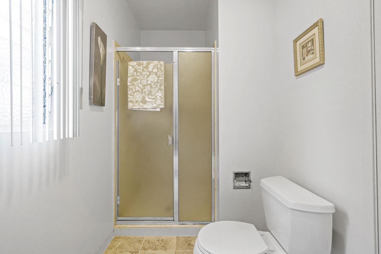 124 Del Mesa Carmel Carmel, CA 93923 - Photo 14 of 28 a white toilet sitting next to a bathroom sink