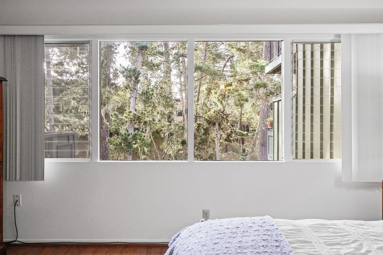 124 Del Mesa Carmel Carmel, CA 93923 - Photo 17 of 28 a view of a room that has a bed and a window