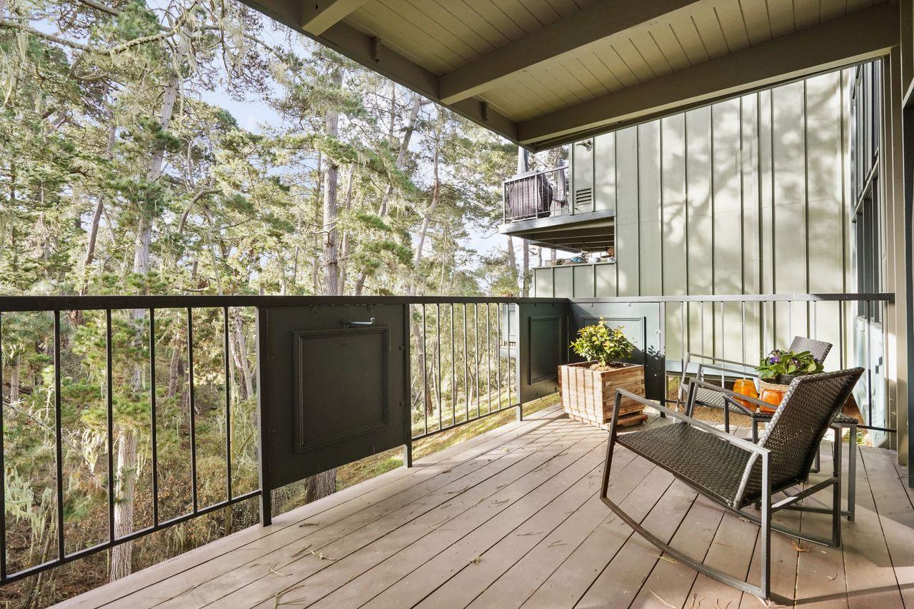 124 Del Mesa Carmel Carmel, CA 93923 - Photo 19 of 28 a balcony with chairs and wooden floor