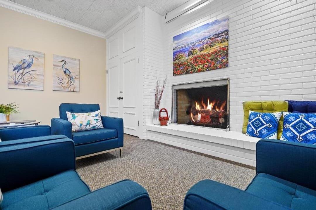 124 Del Mesa Carmel Carmel, CA 93923 - Photo 23 of 28 a living room with furniture and a fireplace